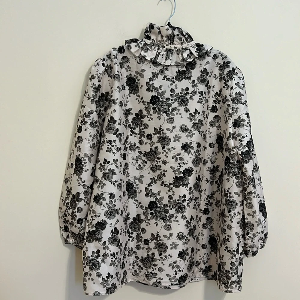 Tuckernuck Black Floral Ruffle-Neck Blouse on Cream